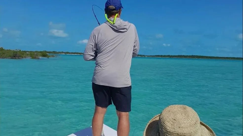 Angler casting across Exuma's clear flats