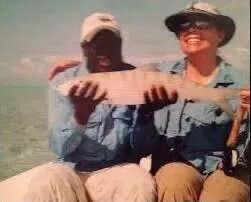 Guest holding a bonefish with a local guide